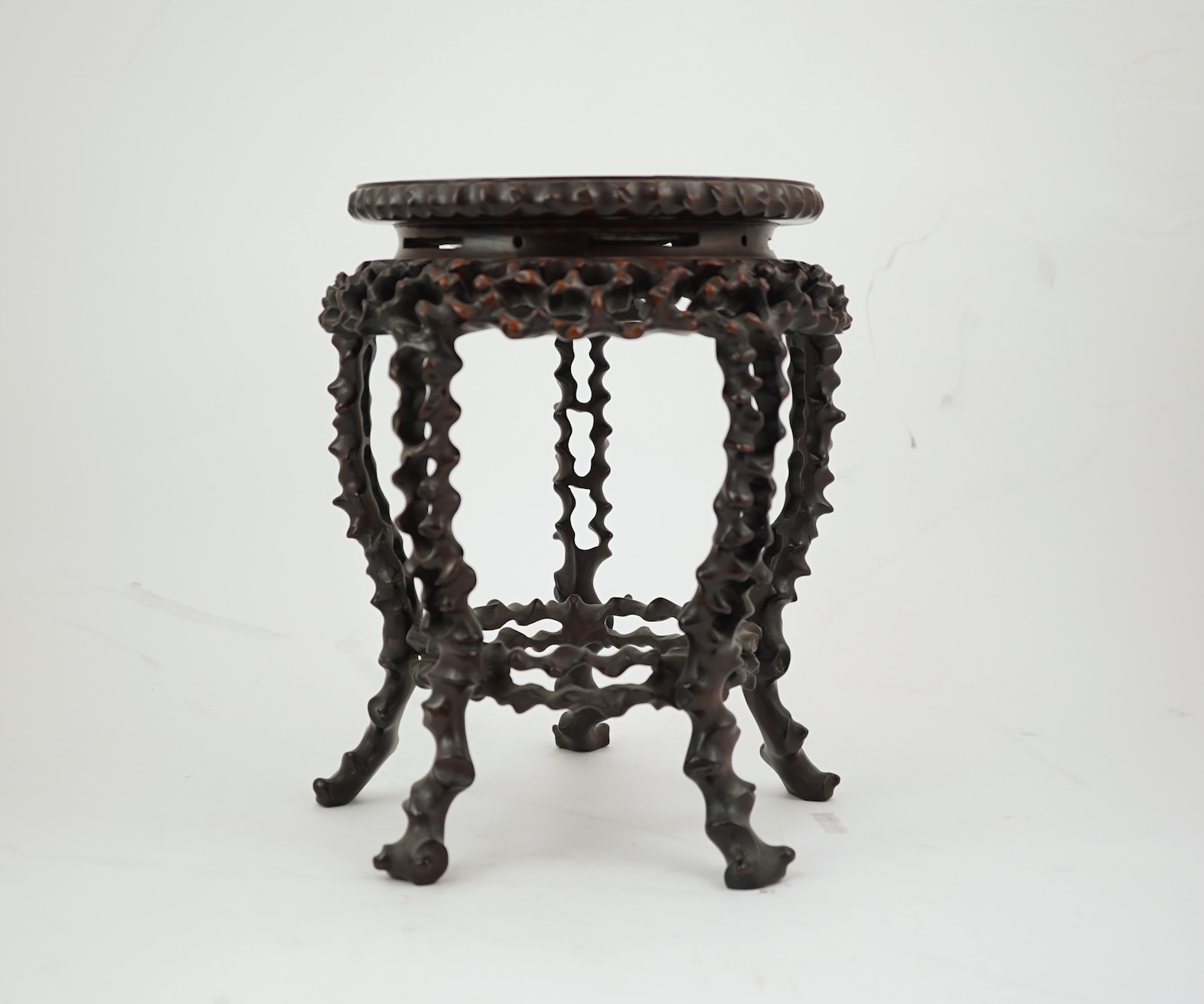 A Chinese hardwood scholar’s stand, carved in imitation of rootwood, early 20th century
